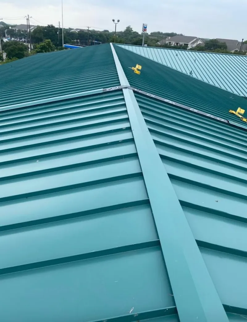Green commercial metal roof ridge and valley for Metal Roof Repair in East Milton