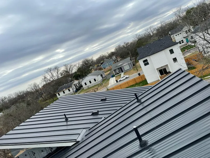 Standing seam metal roof panels with vents for Skylight Repair in East Milton
